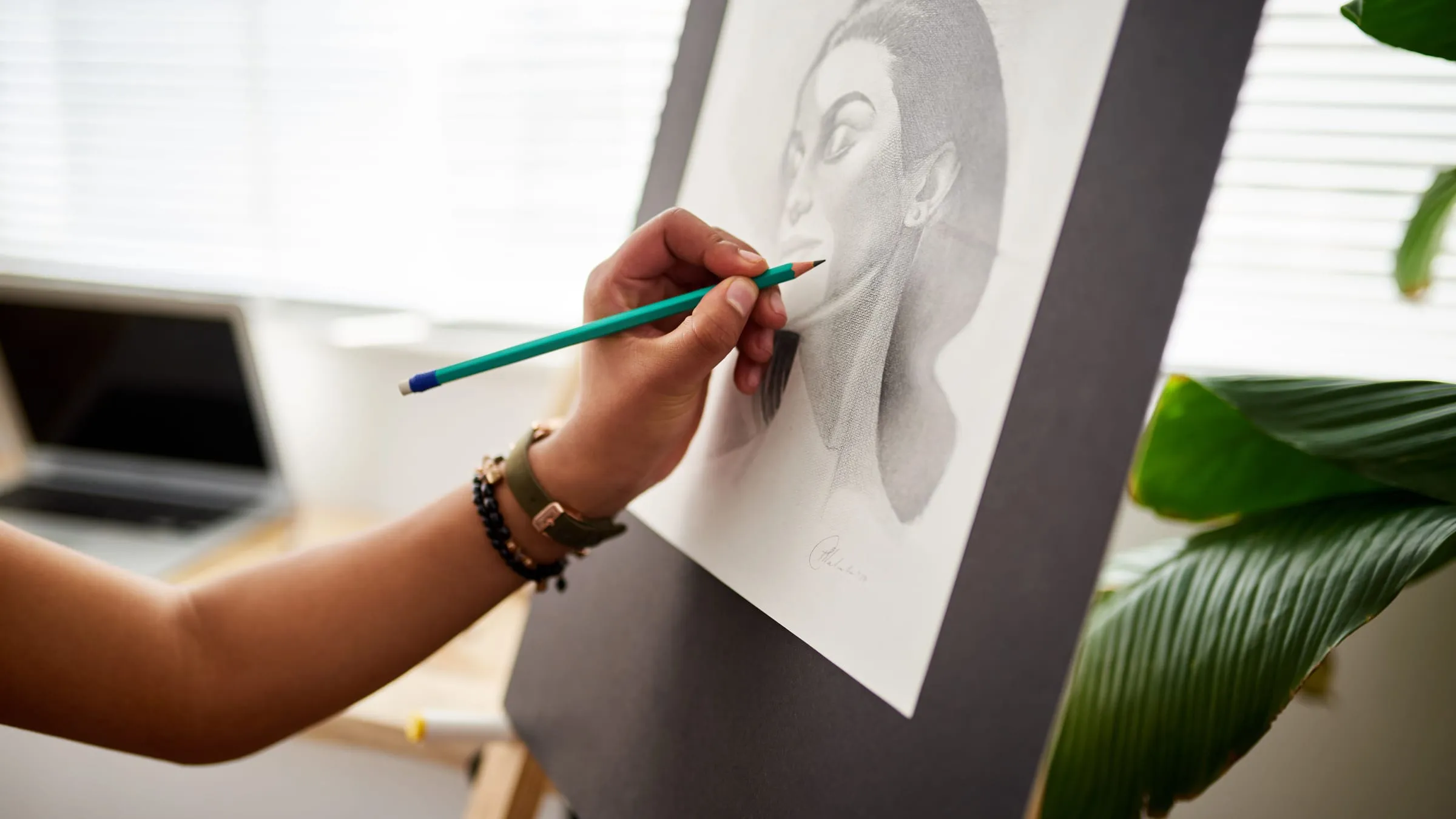 What does my soulmate look like? A pencil portrait of a woman taking shape on an easel